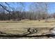 Backyard with tree shadows on the ground at 3546 Stierwalt Rd, Quincy, IN 47456