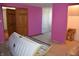 A basement area featuring a large tanning bed and purple and blue painted walls at 3546 Stierwalt Rd, Quincy, IN 47456