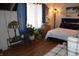 A cozy bedroom with a lamp and a comfortable king bed at 3546 Stierwalt Rd, Quincy, IN 47456