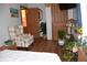A cozy bedroom with vintage furniture and beautiful plants at 3546 Stierwalt Rd, Quincy, IN 47456