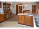 Charming dining area with wood table, chairs, and decorative china cabinet creating a cozy atmosphere at 3546 Stierwalt Rd, Quincy, IN 47456