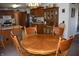 Kitchen view of the dining area, featuring a wood table and wood cabinets at 3546 Stierwalt Rd, Quincy, IN 47456