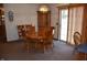 Dining room featuring a wooden table, chairs, and hutch, creating a cozy space for meals at 3546 Stierwalt Rd, Quincy, IN 47456