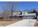Inviting home exterior with attached garage and ample parking on a gravel drive at 3546 Stierwalt Rd, Quincy, IN 47456