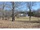 Scenic view of the property featuring a home nestled among mature trees at 3546 Stierwalt Rd, Quincy, IN 47456