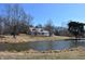 Exterior of property featuring a pond, home and a long drive at 3546 Stierwalt Rd, Quincy, IN 47456