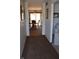 Hallway view of the dining area, featuring hardwood table and sliding door at 3546 Stierwalt Rd, Quincy, IN 47456