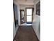 Hallway with carpet and a view to the entryway at 3546 Stierwalt Rd, Quincy, IN 47456