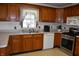 Well-lit kitchen showcasing wood cabinetry, stainless steel appliances, and durable countertops at 3546 Stierwalt Rd, Quincy, IN 47456