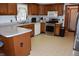 A bright kitchen featuring wood cabinets, a window over the sink, and stainless steel appliances at 3546 Stierwalt Rd, Quincy, IN 47456