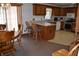 Open eat-in kitchen area featuring wood cabinets and stainless steel appliances at 3546 Stierwalt Rd, Quincy, IN 47456