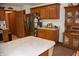 Traditional-style kitchen featuring wood cabinets, stainless steel appliances, and a central island at 3546 Stierwalt Rd, Quincy, IN 47456