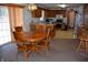 Eat-in kitchen featuring oak cabinets, laminate countertops, and modern appliances at 3546 Stierwalt Rd, Quincy, IN 47456