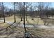 Beautiful landscaped grounds with mature trees and well-maintained pathways at 3546 Stierwalt Rd, Quincy, IN 47456