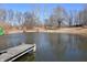 Picturesque view of a pond with a wooden dock at 3546 Stierwalt Rd, Quincy, IN 47456
