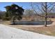 Scenic view of a serene pond, surrounded by mature trees and natural landscape at 3546 Stierwalt Rd, Quincy, IN 47456