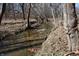 A running stream in the woods on the property at 3546 Stierwalt Rd, Quincy, IN 47456