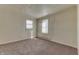 Neutral bedroom with carpeting, two windows and baseboard heating at 4159 N Ridgeview Dr, Indianapolis, IN 46226