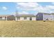 A huge, grassy backyard has ample space between neighboring houses at 4829 Penoyer Ln, Indianapolis, IN 46235