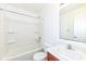A bright bathroom offers a tub and shower combination with a white vanity at 4829 Penoyer Ln, Indianapolis, IN 46235