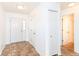 Bright entryway featuring tile flooring, white walls, a double front door and access to the bathroom at 4829 Penoyer Ln, Indianapolis, IN 46235
