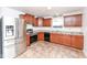 Updated kitchen with stainless steel appliances and granite countertops offers modern convenience at 4829 Penoyer Ln, Indianapolis, IN 46235