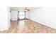 Open living room with neutral walls, large windows and unique tile floors and a ceiling fan at 4829 Penoyer Ln, Indianapolis, IN 46235