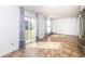 Bright living room with sliding glass doors and neutral flooring offers inviting living space at 4829 Penoyer Ln, Indianapolis, IN 46235