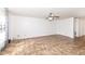 Spacious living room with ceiling fan offers ample space for relaxing and entertaining at 4829 Penoyer Ln, Indianapolis, IN 46235