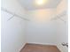 A walk-in closet includes wire shelving and neutral carpet at 4829 Penoyer Ln, Indianapolis, IN 46235