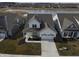An aerial shot of the home displaying the community and nearby pond at 488 Ehrlich Ln, Westfield, IN 46069