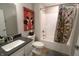 Bathroom with a shower, a toilet and a vanity with a sink and decorative accessories at 488 Ehrlich Ln, Westfield, IN 46069