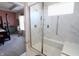 Bathroom featuring walk-in shower with glass door and bench, plus accessible handrails at 488 Ehrlich Ln, Westfield, IN 46069