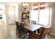 Dining room featuring a wooden table, decorative lighting, and large windows at 488 Ehrlich Ln, Westfield, IN 46069