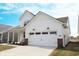 Beautiful two-story home with a two-car garage, brick accents, and a well-manicured lawn at 488 Ehrlich Ln, Westfield, IN 46069