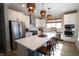 A modern kitchen with stainless steel appliances, a large island, and stylish pendant lighting at 488 Ehrlich Ln, Westfield, IN 46069