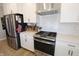 Modern kitchen featuring stainless steel appliances, white subway tile backsplash, and white cabinetry at 488 Ehrlich Ln, Westfield, IN 46069
