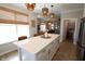 Open kitchen design featuring a spacious island, pendant lighting, and seamless flow to living areas at 488 Ehrlich Ln, Westfield, IN 46069