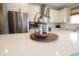 Elegant kitchen island with white countertops, decorative accents, and modern design elements at 488 Ehrlich Ln, Westfield, IN 46069