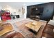A modern living room features a large flat screen tv and comfortable leather seating at 488 Ehrlich Ln, Westfield, IN 46069