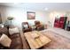 Inviting living room with large TV, leather furniture, and a decorative rug for cozy and stylish gathering space at 488 Ehrlich Ln, Westfield, IN 46069