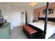 Beautiful main bedroom with a four poster bed, hardwood floors, and an ensuite bathroom with a stand alone shower at 488 Ehrlich Ln, Westfield, IN 46069