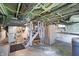The basement is unfinished and utilitarian with exposed duct work and utility systems at 505 W Washington St, Shelbyville, IN 46176