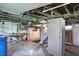 A basement features storage and a utility area with a workbench at 505 W Washington St, Shelbyville, IN 46176