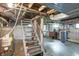A basement staircase is shown with a water heater at 505 W Washington St, Shelbyville, IN 46176