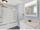 Bathroom featuring a glass enclosed tub/shower and a vanity with bright lighting at 505 W Washington St, Shelbyville, IN 46176