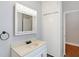 Bathroom featuring vanity with bright lighting and a linen closet at 505 W Washington St, Shelbyville, IN 46176