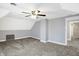 Neutral bedroom featuring a modern ceiling fan, gray paint, and wall to wall carpet at 505 W Washington St, Shelbyville, IN 46176