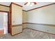 Bright, well-lit bedroom with natural light, plush carpet, and adjacent room at 505 W Washington St, Shelbyville, IN 46176