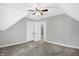 Bedroom featuring a modern ceiling fan, closet, and neutral gray walls and carpet at 505 W Washington St, Shelbyville, IN 46176